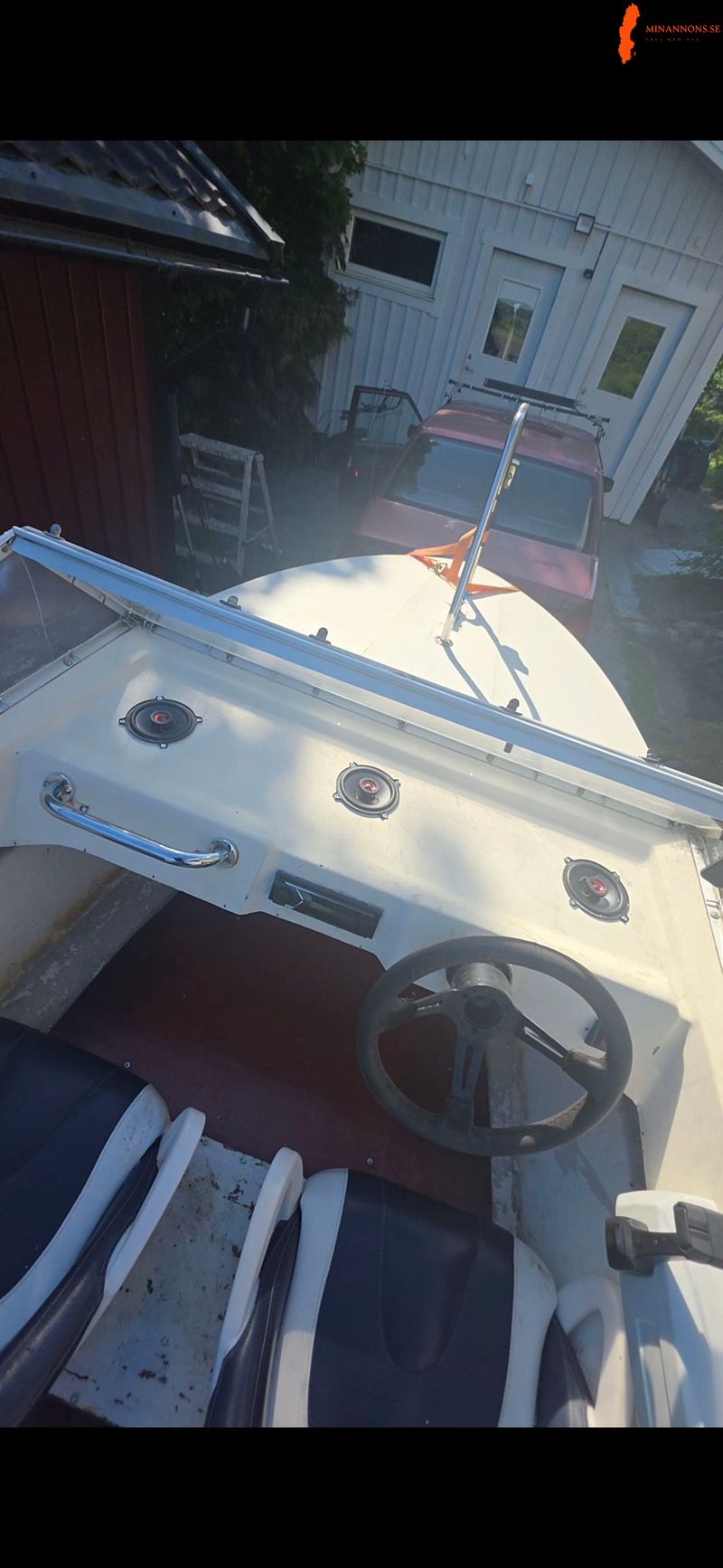 byteskoll-sportbat-med-20-hk-evinrude-fran-1985